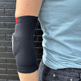 Side view of FP Low profile elbow pad fits under clothing