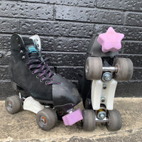 CIB slide grind blocks installed on black sure-grip boardwalk roller skates