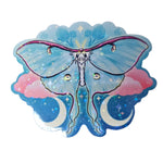 Sticker of a colorful butterfly design on a wooden surface