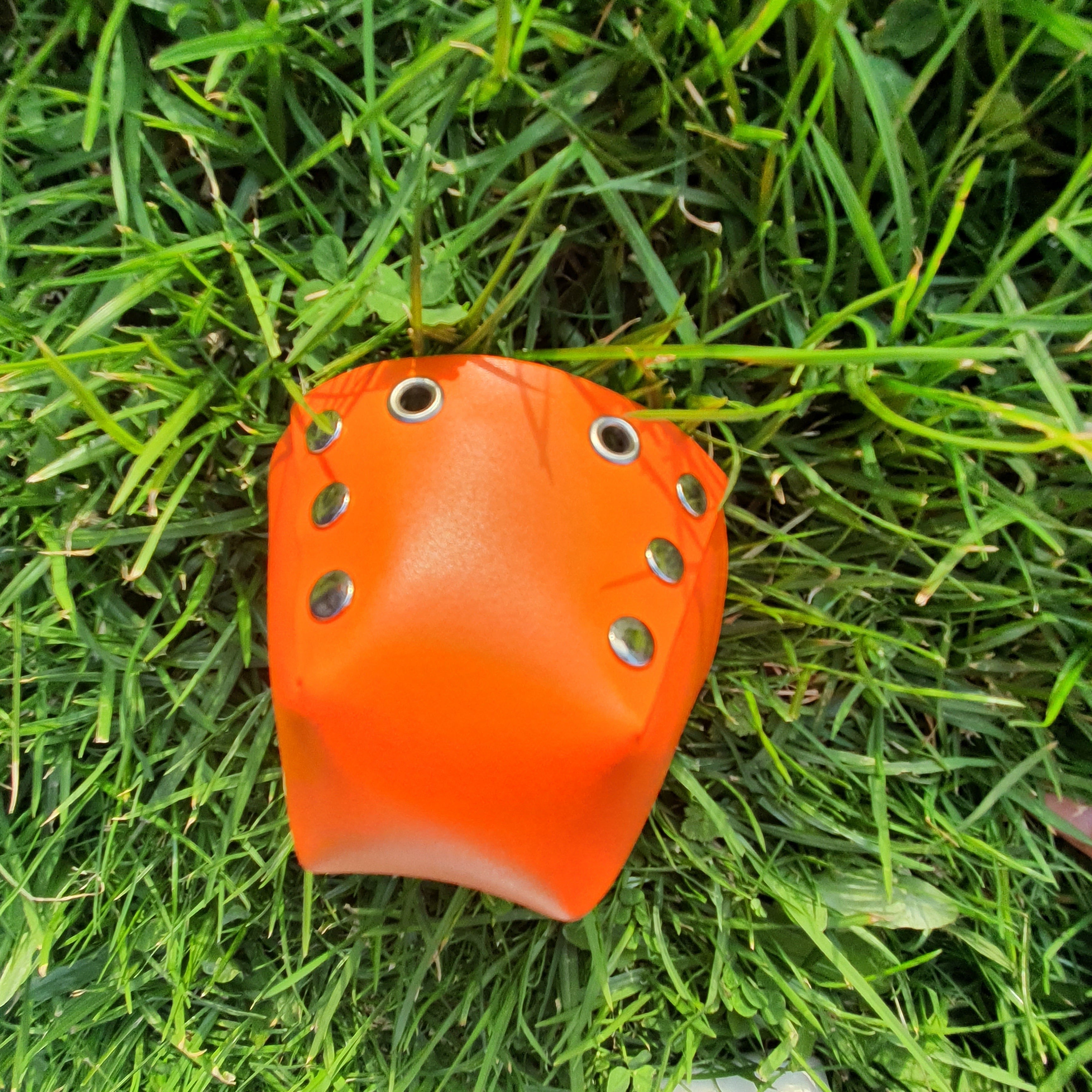 Orange studded toe caps to cover and protect our roller skates