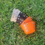 A set of colorful knee tap Roller Skate park toe caps with metallic studs 